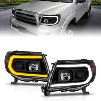 ANZO 05-11 Toyota Tacoma Projector Headlights w/Light Bar Switchback Black Housing - Image 1